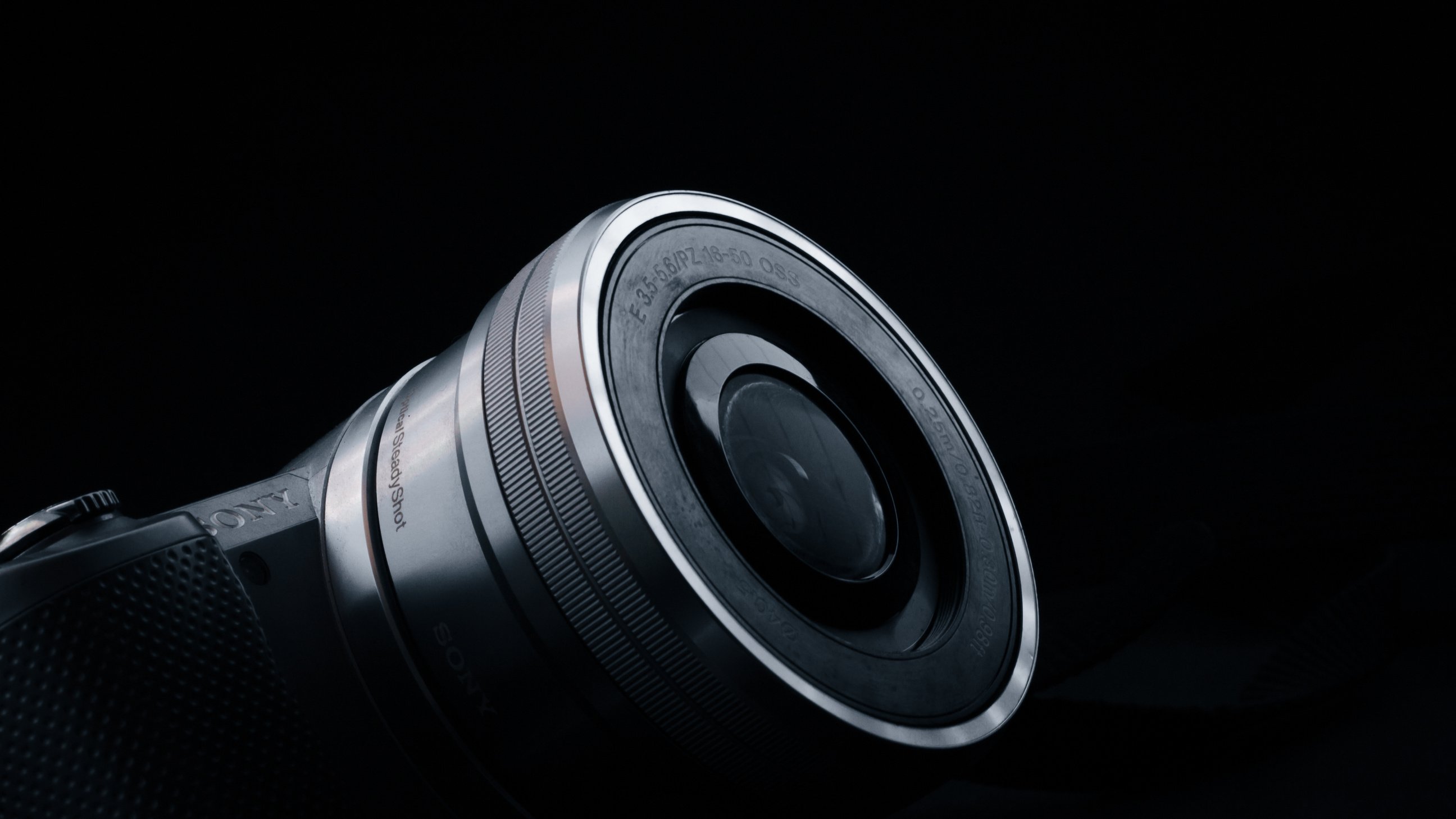 Camera Lens on Black Surface